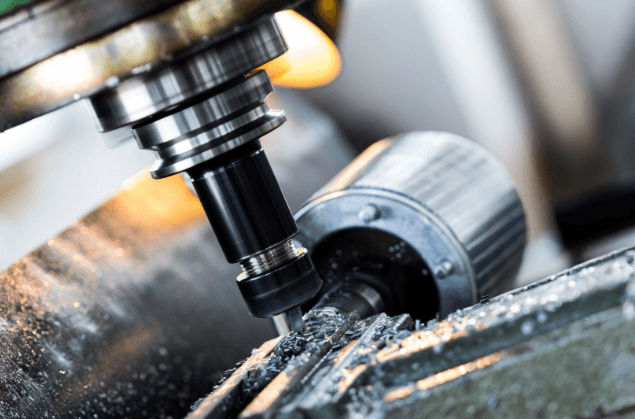 CNC machine drilling a high-precision aerospace component.