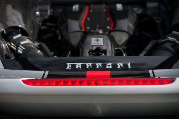 Rear view of a Ferrari engine bay featuring exposed carbon fiber automotive parts