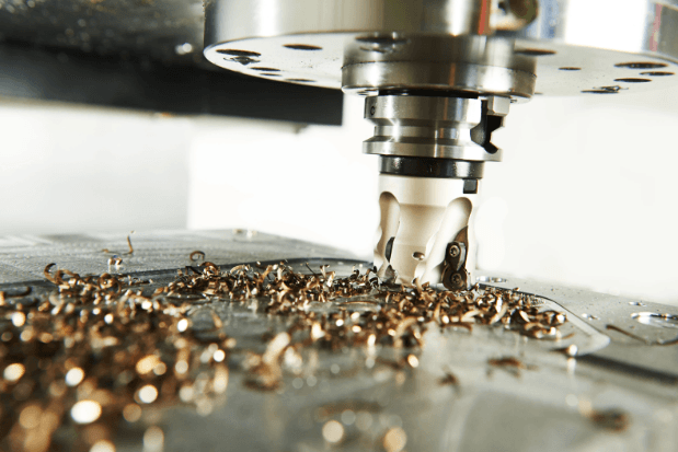 Metal chips produced during CNC machining of aerospace-grade material.