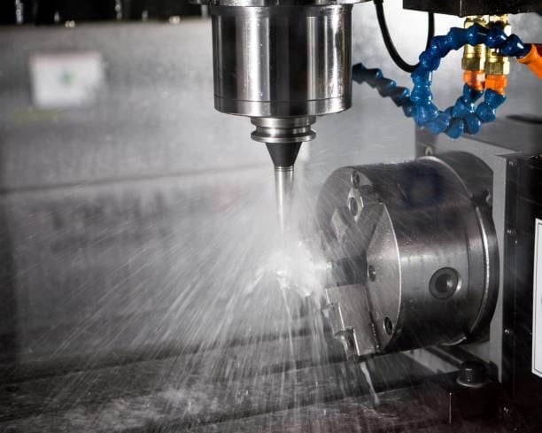 4-axis CNC machining process at A-1 Machining using coolant to maintain precision
