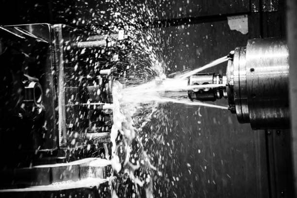 Coolant spray during high-speed CNC machining operation at A-1 Machining