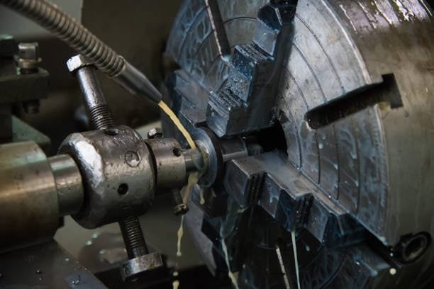 Close-up rotary machining process creating precision metal components at A-1 Machining