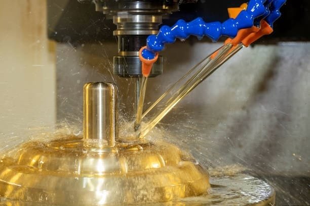 CNC machining using cutting fluid for cooling and smoother operation.