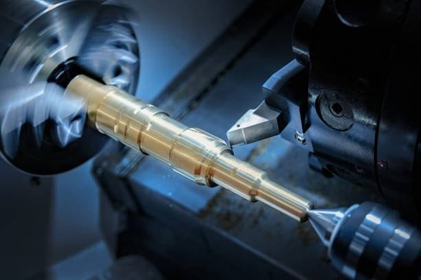 Close-up of a CNC milling machine shaping a metal workpiece for precision machining applications.