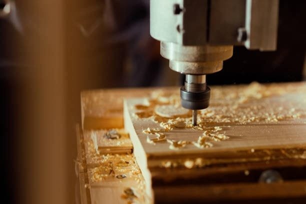 CNC router machine carving wood for customized woodworking products.