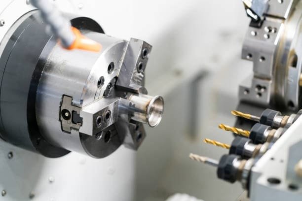 CNC turning lathe machine shaping a precision metal component.