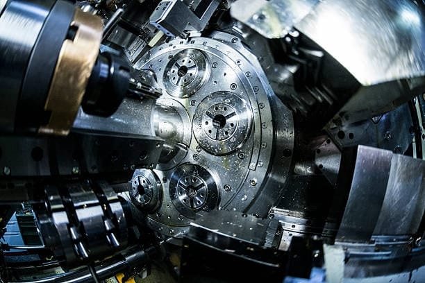 Close-up view of a complex CNC lathe machining center with multiple tool holders.