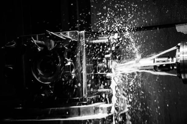 Coolant sprayed on CNC machining tool during precision part manufacturing at A-1 Machining