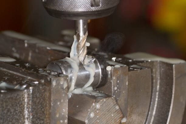 End milling machine applying coolant while machining custom precision parts at A-1 Machining