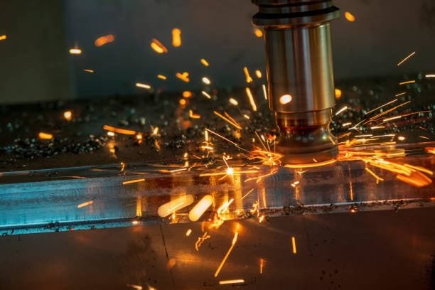 High feed rate machining with visible green sparks on metal surface.
