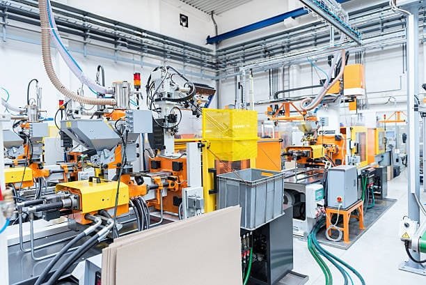 Industrial machines for high-volume metal injection molding manufacturing