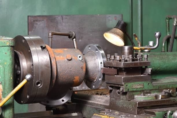 Manual lathe setup used in machining a large flange component at A-1 Machining