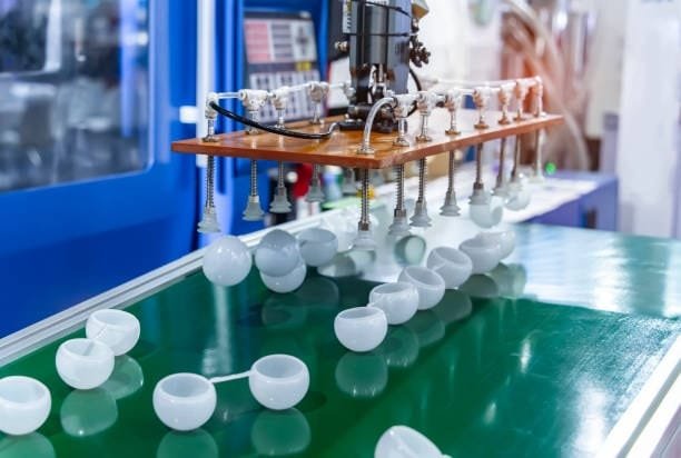 Automated robotic system handling parts in metal injection molding