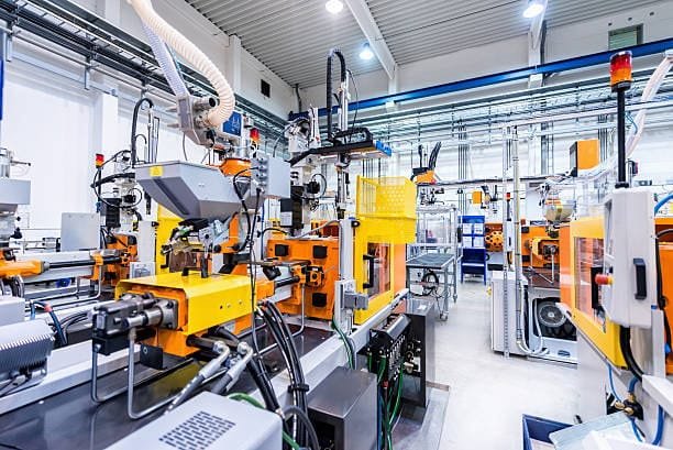 Automated metal injection molding production line in a factory