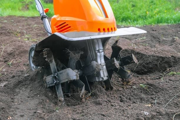 Agricultural tilling machine working in the soil