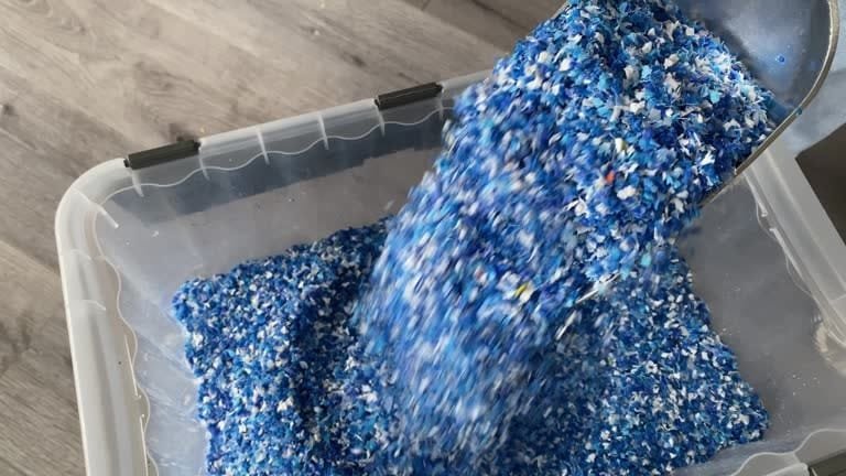 Recycled plastic pellets being collected for reuse in the plastic manufacturing process.