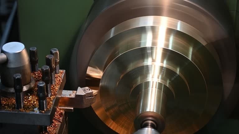 Precision turning operation showing controlled feed rate and smooth metal surface.