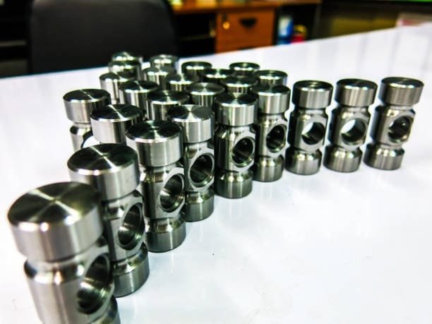 Group of CNC machined components demonstrating precision machining tolerances.