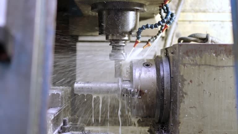 Rotary CNC machining process with coolant spray during custom part manufacturing at A-1 Machining