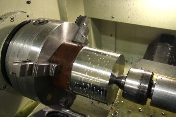 Rotary CNC machining of a metal cylinder at A-1 Machining for custom parts production