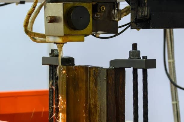 Sparks during EDM wire cutting operation on metal block
