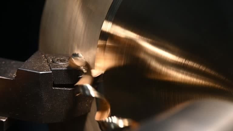 Lathe turning process highlighting cutting speed with metal chip removal.