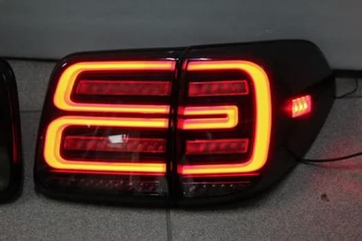 Illuminated automotive LED tail light prototype with red LED strip design