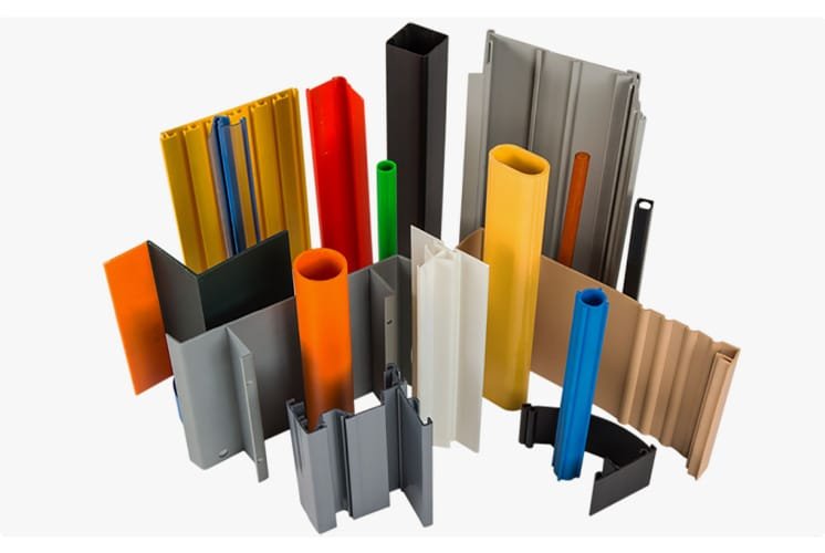 Collection of colorful plastic and aluminum extrusion profiles showcasing diverse cross-sectional shapes