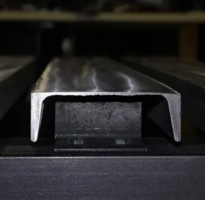 Close-up of a U-shaped aluminum extrusion profile with uniform cross-section