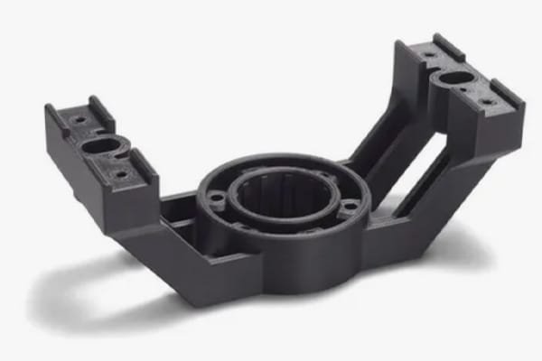 Black 3D printed engine mount bracket with complex geometric features