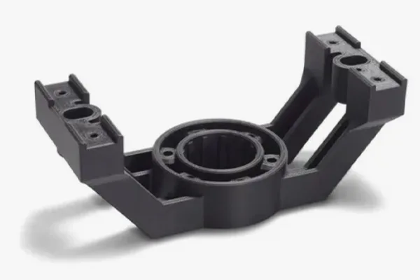 Black 3D printed engine mount bracket with complex geometric features