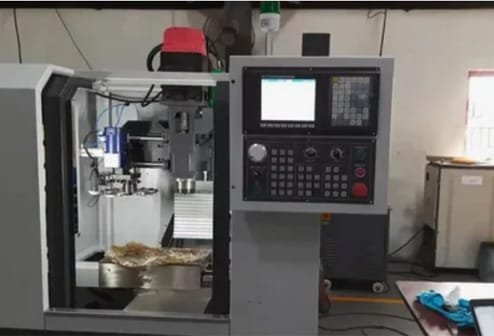 4-axis CNC machine performing precision milling with live tooling abilities