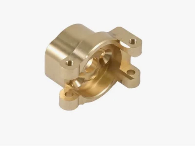 CNC machined brass housing showcasing high-precision milling and turning
