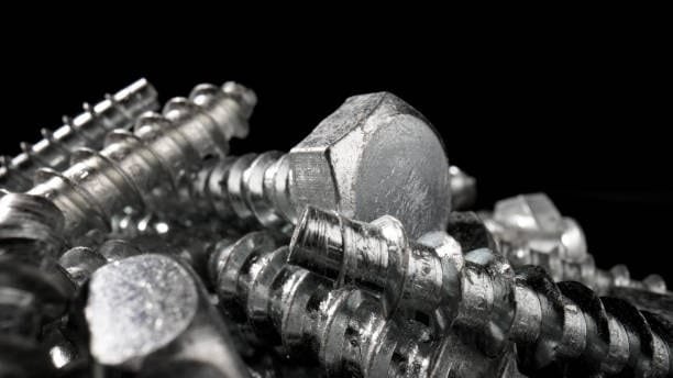 Shiny silver steel fasteners viewed in macro to emphasize structural hardness