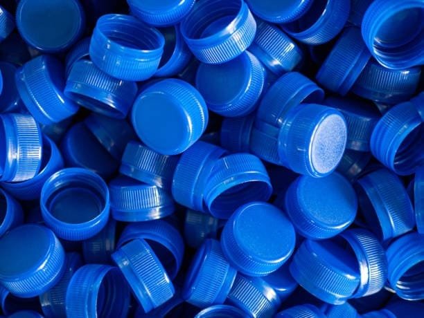 Plastic waste compressed into large bundles for reuse in molding industry