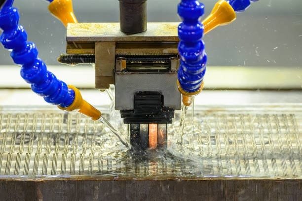 Close-up of sinker EDM spark erosion using dielectric fluid cooling