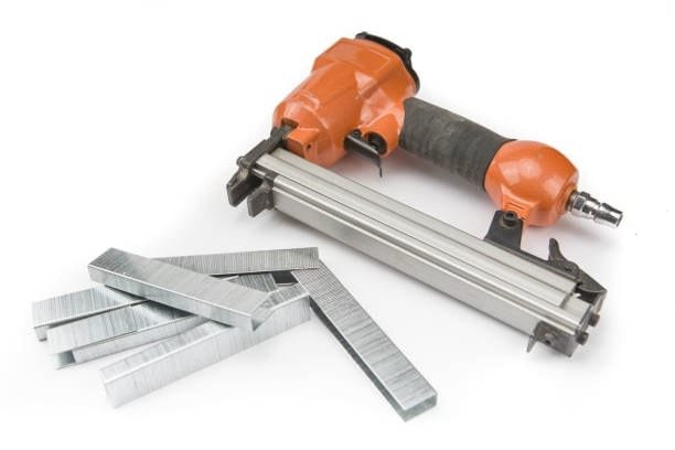 Brad nailer with stacked metal staples used for CNC router workholding