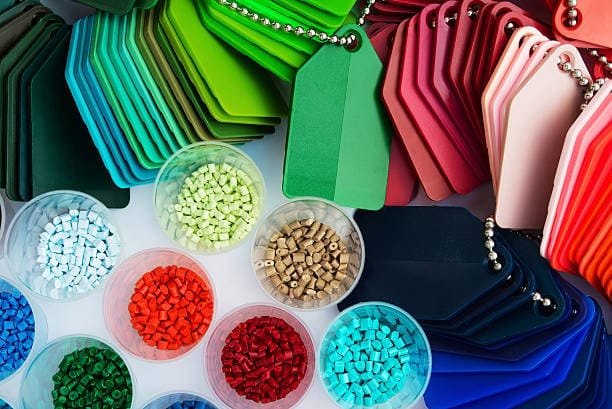 Plastic resin granules and color swatch samples for selecting molding materials