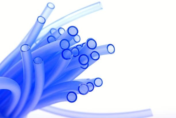 Blue plastic tubes produced through compression molding process