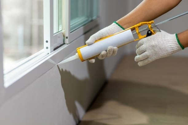Sealant being applied on a roof surface to ensure airtight workholding zones
